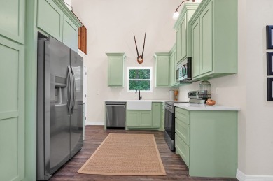 Modern Elegance meets Tranquil Luxury in this 2023-built on Rayburn Country Club in Texas - for sale on GolfHomes.com, golf home, golf lot