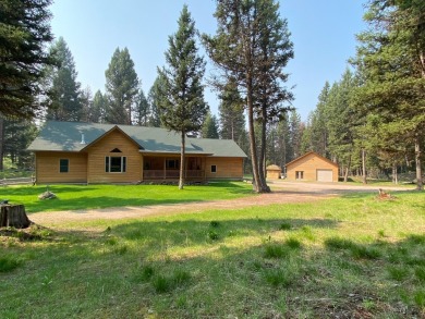 Single level living on wooded acreage at the end of a quiet cul on Double Arrow Lodge in Montana - for sale on GolfHomes.com, golf home, golf lot