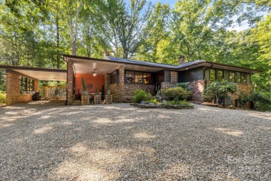 Access this beautifully remodeled Wright-inspired midcentury on Tryon Country Club in North Carolina - for sale on GolfHomes.com, golf home, golf lot