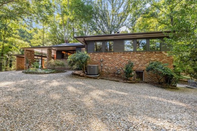 Access this beautifully remodeled Wright-inspired midcentury on Tryon Country Club in North Carolina - for sale on GolfHomes.com, golf home, golf lot