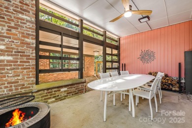 Access this beautifully remodeled Wright-inspired midcentury on Tryon Country Club in North Carolina - for sale on GolfHomes.com, golf home, golf lot