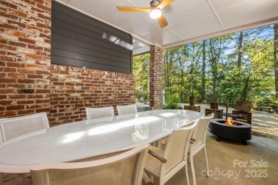 Access this beautifully remodeled Wright-inspired midcentury on Tryon Country Club in North Carolina - for sale on GolfHomes.com, golf home, golf lot
