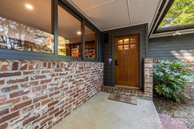 Access this beautifully remodeled Wright-inspired midcentury on Tryon Country Club in North Carolina - for sale on GolfHomes.com, golf home, golf lot