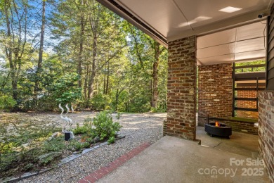 Access this beautifully remodeled Wright-inspired midcentury on Tryon Country Club in North Carolina - for sale on GolfHomes.com, golf home, golf lot