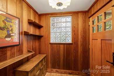 Access this beautifully remodeled Wright-inspired midcentury on Tryon Country Club in North Carolina - for sale on GolfHomes.com, golf home, golf lot