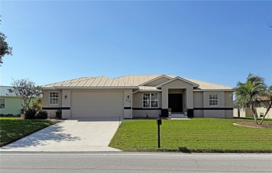 Impressive 3 Bedroom, 2 Bathroom WATERFRONT home with attached 2 on Saint Andrews South Golf Club in Florida - for sale on GolfHomes.com, golf home, golf lot
