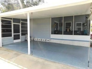 PICTURES SAY IT ALL! Uniquely designed 2 bedroom 2 bath on Grasslands Golf and Country Club in Florida - for sale on GolfHomes.com, golf home, golf lot
