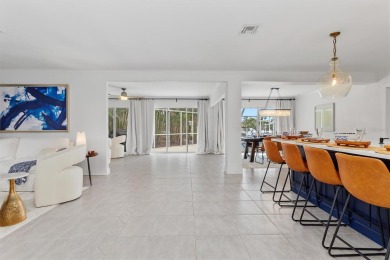 Step inside this beautifully updated coastal retreat and on Saint Andrews South Golf Club in Florida - for sale on GolfHomes.com, golf home, golf lot