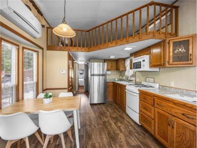 Experience seasonal living at its finest in the gated commnunity on Travelers Country Club in Minnesota - for sale on GolfHomes.com, golf home, golf lot