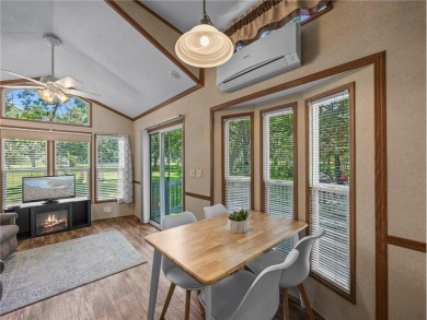 Experience seasonal living at its finest in the gated commnunity on Travelers Country Club in Minnesota - for sale on GolfHomes.com, golf home, golf lot