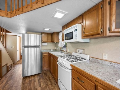 Experience seasonal living at its finest in the gated commnunity on Travelers Country Club in Minnesota - for sale on GolfHomes.com, golf home, golf lot