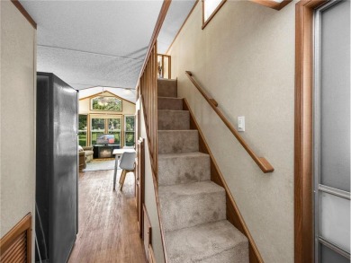 Experience seasonal living at its finest in the gated commnunity on Travelers Country Club in Minnesota - for sale on GolfHomes.com, golf home, golf lot