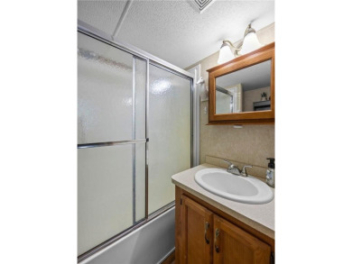 Experience seasonal living at its finest in the gated commnunity on Travelers Country Club in Minnesota - for sale on GolfHomes.com, golf home, golf lot