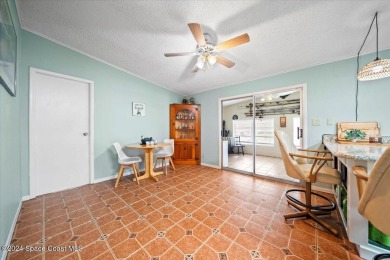 Welcome home! This 2 bed 2 bath home has over 1700 sf of living on Barefoot Bay Golf Course in Florida - for sale on GolfHomes.com, golf home, golf lot