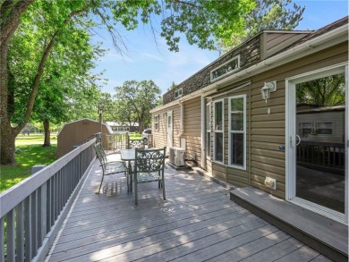 Experience seasonal living at its finest in the gated commnunity on Travelers Country Club in Minnesota - for sale on GolfHomes.com, golf home, golf lot