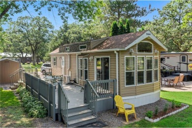 Experience seasonal living at its finest in the gated commnunity on Travelers Country Club in Minnesota - for sale on GolfHomes.com, golf home, golf lot