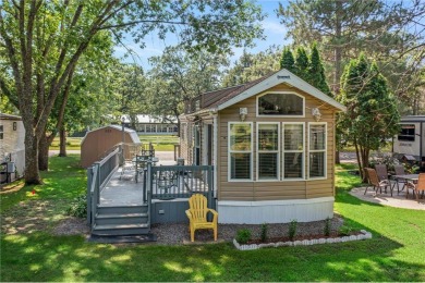 Experience seasonal living at its finest in the gated commnunity on Travelers Country Club in Minnesota - for sale on GolfHomes.com, golf home, golf lot