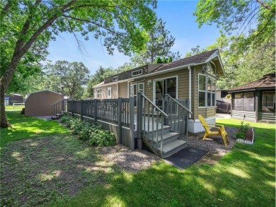 Experience seasonal living at its finest in the gated commnunity on Travelers Country Club in Minnesota - for sale on GolfHomes.com, golf home, golf lot