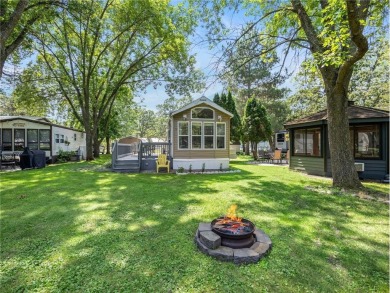 Experience seasonal living at its finest in the gated commnunity on Travelers Country Club in Minnesota - for sale on GolfHomes.com, golf home, golf lot