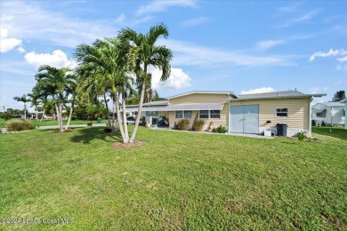 Welcome home! This 2 bed 2 bath home has over 1700 sf of living on Barefoot Bay Golf Course in Florida - for sale on GolfHomes.com, golf home, golf lot