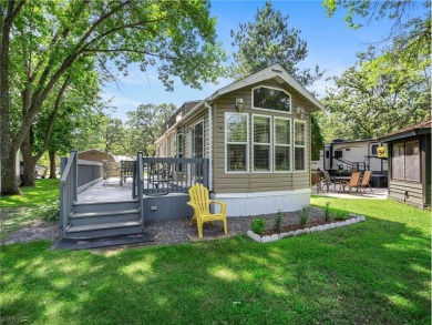 Experience seasonal living at its finest in the gated commnunity on Travelers Country Club in Minnesota - for sale on GolfHomes.com, golf home, golf lot