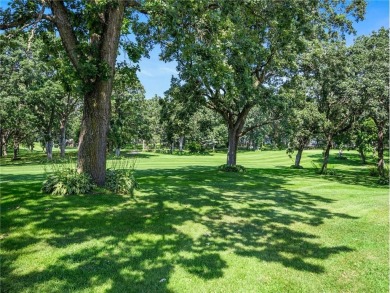 Experience seasonal living at its finest in the gated commnunity on Travelers Country Club in Minnesota - for sale on GolfHomes.com, golf home, golf lot