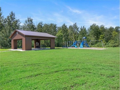 Experience seasonal living at its finest in the gated commnunity on Travelers Country Club in Minnesota - for sale on GolfHomes.com, golf home, golf lot