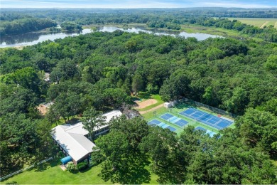 Experience seasonal living at its finest in the gated commnunity on Travelers Country Club in Minnesota - for sale on GolfHomes.com, golf home, golf lot