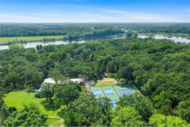 Experience seasonal living at its finest in the gated commnunity on Travelers Country Club in Minnesota - for sale on GolfHomes.com, golf home, golf lot