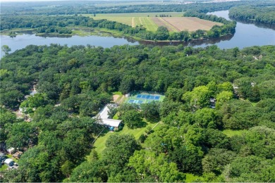 Experience seasonal living at its finest in the gated commnunity on Travelers Country Club in Minnesota - for sale on GolfHomes.com, golf home, golf lot