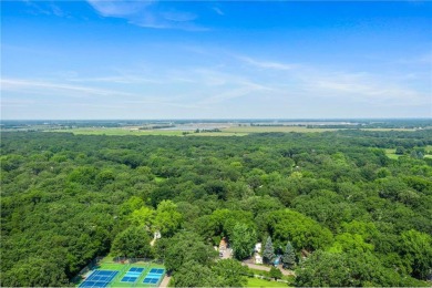 Experience seasonal living at its finest in the gated commnunity on Travelers Country Club in Minnesota - for sale on GolfHomes.com, golf home, golf lot