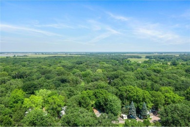 Experience seasonal living at its finest in the gated commnunity on Travelers Country Club in Minnesota - for sale on GolfHomes.com, golf home, golf lot