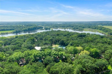 Experience seasonal living at its finest in the gated commnunity on Travelers Country Club in Minnesota - for sale on GolfHomes.com, golf home, golf lot