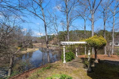 Welcome to your lakeside retreat at MacGregor Downs! Step into on MacGregor Downs Country Club in North Carolina - for sale on GolfHomes.com, golf home, golf lot