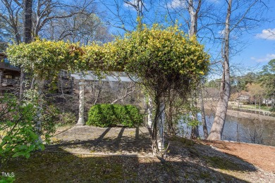 Welcome to your lakeside retreat at MacGregor Downs! Step into on MacGregor Downs Country Club in North Carolina - for sale on GolfHomes.com, golf home, golf lot