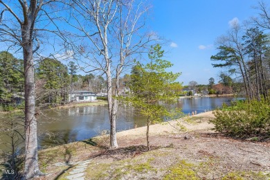 Welcome to your lakeside retreat at MacGregor Downs! Step into on MacGregor Downs Country Club in North Carolina - for sale on GolfHomes.com, golf home, golf lot