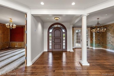 This exquisite French Country-inspired residence is situated on Forest Lake Country Club in Michigan - for sale on GolfHomes.com, golf home, golf lot