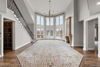 This exquisite French Country-inspired residence is situated on Forest Lake Country Club in Michigan - for sale on GolfHomes.com, golf home, golf lot