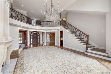 This exquisite French Country-inspired residence is situated on Forest Lake Country Club in Michigan - for sale on GolfHomes.com, golf home, golf lot