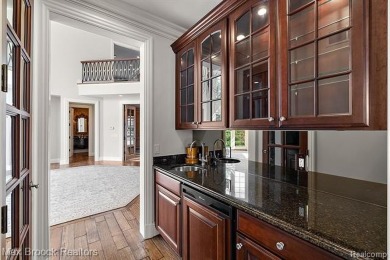 This exquisite French Country-inspired residence is situated on Forest Lake Country Club in Michigan - for sale on GolfHomes.com, golf home, golf lot