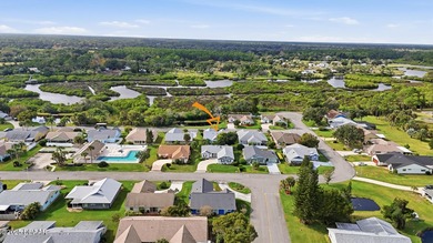 Beautifully updated home in a quiet New Smyrna Beach on Hidden Lakes Golf Club in Florida - for sale on GolfHomes.com, golf home, golf lot