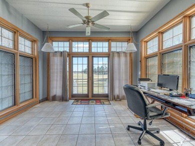 Lovely ranch style home with a spectacular view overlooking the on Carrington Golf Club in Michigan - for sale on GolfHomes.com, golf home, golf lot