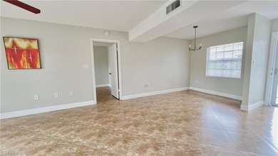 Centrally located condo offers comfort and style in every detail on Quail Run Golf Club In Naples in Florida - for sale on GolfHomes.com, golf home, golf lot