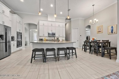 Step into effortless elegance in this beautifully appointed on Amelia National Golf and Country Club in Florida - for sale on GolfHomes.com, golf home, golf lot