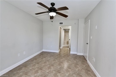 Centrally located condo offers comfort and style in every detail on Quail Run Golf Club In Naples in Florida - for sale on GolfHomes.com, golf home, golf lot