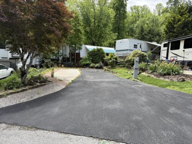 Beautifully landscaped VACANT lot with a great view located in a on Bent Creek Golf Course in Tennessee - for sale on GolfHomes.com, golf home, golf lot