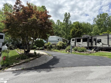 Beautifully landscaped VACANT lot with a great view located in a on Bent Creek Golf Course in Tennessee - for sale on GolfHomes.com, golf home, golf lot