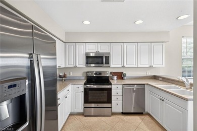 Relax and enjoy STUNNING LAKE AND GOLF COURSE VIEWS from this on Shadow Wood Country Club in Florida - for sale on GolfHomes.com, golf home, golf lot