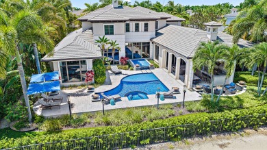 As you step into the exquisite entrance of this luxurious estate on Old Palm Golf Club in Florida - for sale on GolfHomes.com, golf home, golf lot