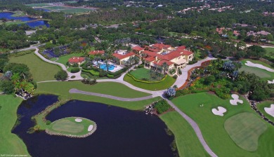 As you step into the exquisite entrance of this luxurious estate on Old Palm Golf Club in Florida - for sale on GolfHomes.com, golf home, golf lot